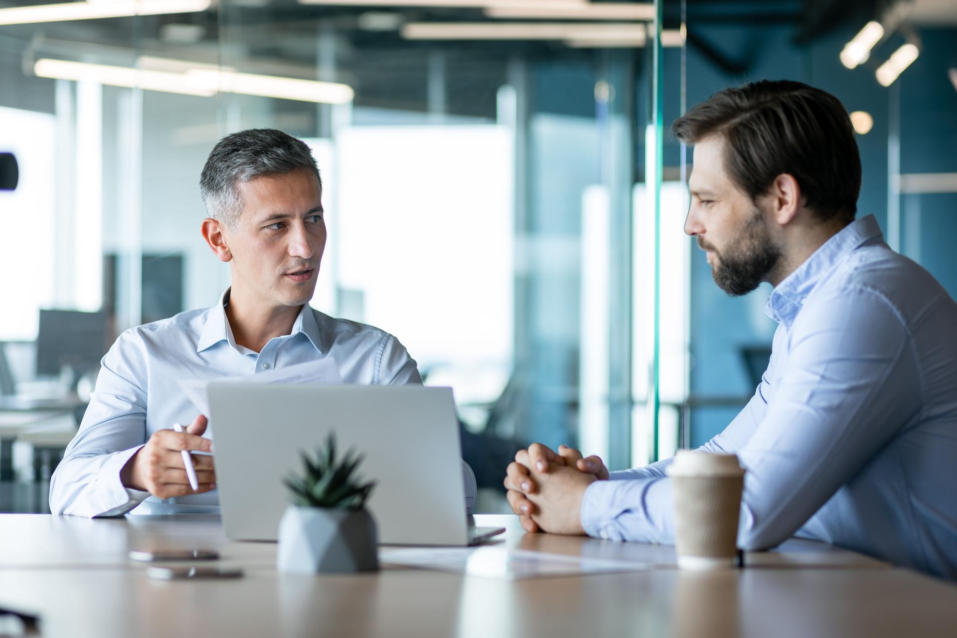Professional Business Meeting Between Two Colleagues in Modern Office