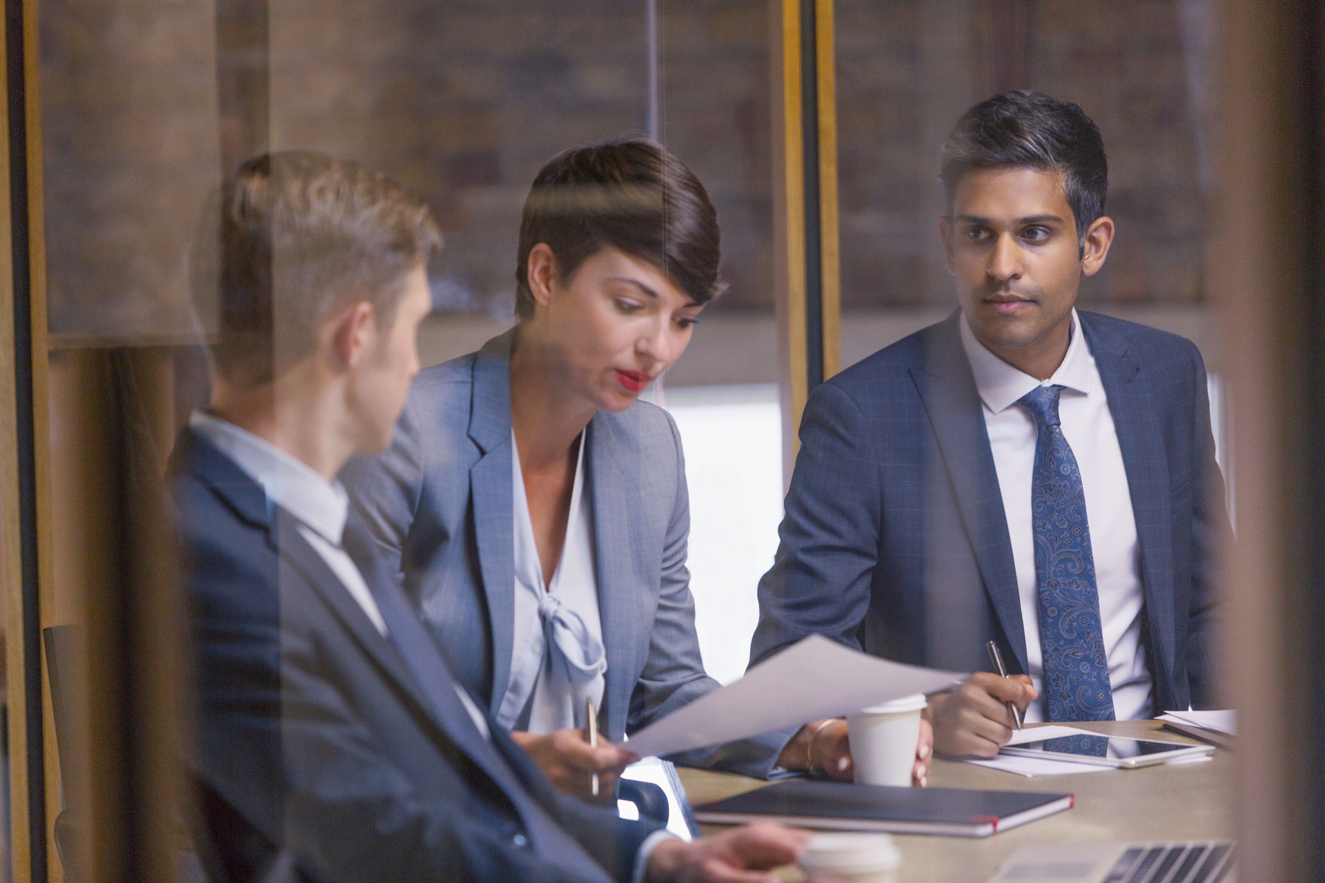 Business people reviewing paperwork in meeting